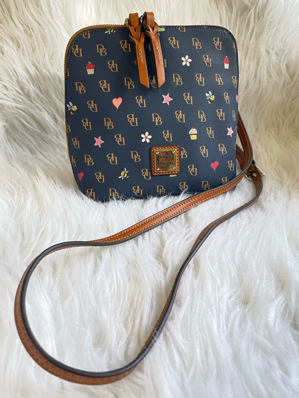 Dooney & Bourke Navy Crossbody with Brown Leather Trim and Playful Motifs